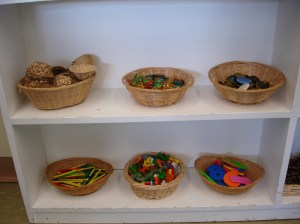 Math materials have been chosen purposely to encourage counting and sorting.