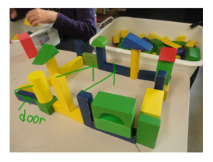 A photo showing a student who struggled with adding a roof to her structure.