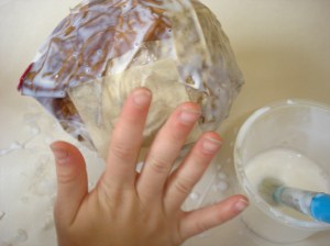 Our representation of the chrysalis stage: creating a chrysalis out of papier mache. The children added finer details with permanent markers when their work was dry.