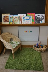 "Teacher Centre" A quiet place to re-enact classroom routines, read books, and play with literacy materials.