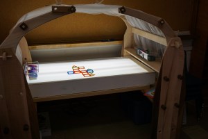 Light Table (currently stocked with Magformers - one of our new favourite materials). The overhead canopy creates a really quiet and cozy space for exploring.