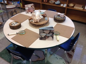 Science and Nature centre. Currently set up with rocks and shells from the beach ("What do you notice?"). I will also be providing the children with jars of water and small brushes for them to experiment with how the water affects the look of the rocks and shells.